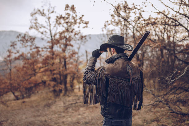 Hunter with Wild Pony Cowboy Hat In The Wild