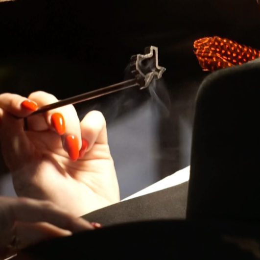 Custom company logo branding on cowboy hat for corporate event