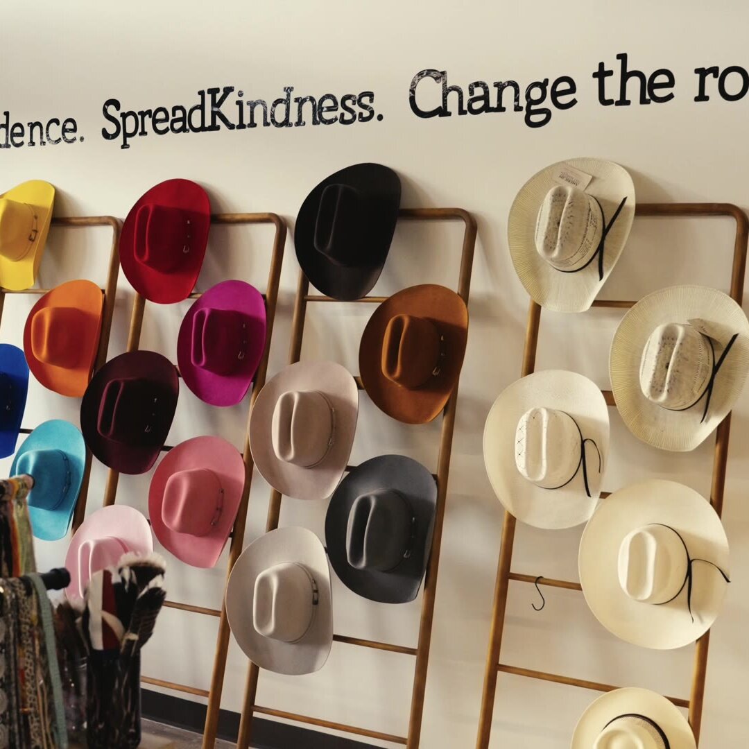 Colorful felt cowboy hats on the hat wall at Wild Pony Hat Bar inside Basila Frocks in San Antonio